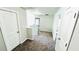 Hallway featuring plush carpet, white doors, and natural light at 4417 Belcamp Rd, Fairburn, GA 30213