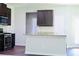 Kitchen with stainless steel appliances, granite countertops, and dark brown cabinets at 4417 Belcamp Rd, Fairburn, GA 30213