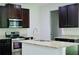 Kitchen with stainless steel appliances, granite countertops, and dark brown cabinets at 4417 Belcamp Rd, Fairburn, GA 30213