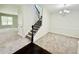 Living room view of stairway and chandelier lighting at 4417 Belcamp Rd, Fairburn, GA 30213