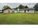 Spacious backyard with lush lawn, detached shed, and ample space for outdoor activities at 2433 Robin Ridge Dr, Dacula, GA 30019