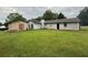Spacious backyard with lush lawn, detached shed, and ample space for outdoor activities at 2433 Robin Ridge Dr, Dacula, GA 30019