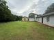 Expansive backyard with green lawn and partial view of the house at 2433 Robin Ridge Dr, Dacula, GA 30019