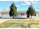 Charming single-story home featuring an attached garage and a well-maintained lawn at 2433 Robin Ridge Dr, Dacula, GA 30019