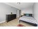 Bright bedroom showcasing a patterned rug, hardwood floors, dresser and a side table at 2479 Peachtree Ne Rd # 301, Atlanta, GA 30305