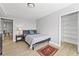 Bedroom with wood floors, closet, and a patterned rug adds warmth to the space at 2479 Peachtree Ne Rd # 301, Atlanta, GA 30305