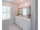 The bathroom showcases a vanity with a large mirror, complemented by modern lighting fixtures at 4408 Shiloh Trl, Powder Springs, GA 30127