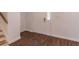 Inviting entryway boasts wood-look tile floors and a bright white front door with glass inserts at 4408 Shiloh Trl, Powder Springs, GA 30127