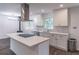Contemporary kitchen featuring white cabinets, stainless steel appliances, and a center island at 4408 Shiloh Trl, Powder Springs, GA 30127