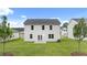 This is the exterior rear of the home highlighting the backyard with ample space at 1622 Palladian Way, Lithonia, GA 30058