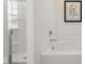 Clean bathroom features a tub with shower and enclosed glass shower at 1622 Palladian Way, Lithonia, GA 30058