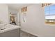 Bathroom featuring double sinks, tiled floor, and community views at 1622 Palladian Way, Lithonia, GA 30058