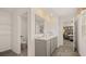 Bathroom with double sinks, tiled floor, and access to the bedroom at 1622 Palladian Way, Lithonia, GA 30058