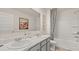 Bathroom featuring a double sink vanity, white cabinets, and a shower tub combo with a curtain at 1622 Palladian Way, Lithonia, GA 30058