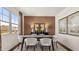 Stylish dining room featuring modern decor, ample natural light, and a cozy rug, ideal for entertaining guests at 1622 Palladian Way, Lithonia, GA 30058
