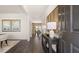 Inviting entryway with dark wood floors, stylish console table and decorative wall art creating a warm and welcoming atmosphere at 1622 Palladian Way, Lithonia, GA 30058