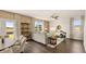 A cozy living room has a ceiling fan, neutral walls, large windows with curtains, and a comfortable sectional sofa at 1622 Palladian Way, Lithonia, GA 30058