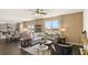 The open-concept living area includes a kitchen, dining space, living room, and lots of light from the large windows at 1622 Palladian Way, Lithonia, GA 30058