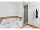 Bathroom with a corner bathtub and a glass enclosed shower at 195 Blackberry Run, Fayetteville, GA 30214