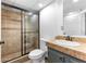 Tiled bathroom featuring a glass-enclosed shower and vanity at 195 Blackberry Run, Fayetteville, GA 30214