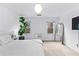 Bright bedroom featuring a plant near windows, simple decor, and soft natural light at 195 Blackberry Run, Fayetteville, GA 30214