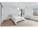 Sun-lit bedroom with plush bedding, neutral decor, and a serene view from the window at 195 Blackberry Run, Fayetteville, GA 30214