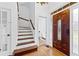 Charming entryway with wood floors, a decorative front door, and a staircase at 195 Blackberry Run, Fayetteville, GA 30214