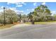 Scenic view of property surrounded by trees, long driveway, and manicured front yard at 195 Blackberry Run, Fayetteville, GA 30214