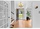 Bright entryway featuring hardwood floors, staircase, and front door view at 195 Blackberry Run, Fayetteville, GA 30214