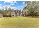 Traditional home featuring well-maintained front lawn and mature trees at 195 Blackberry Run, Fayetteville, GA 30214