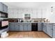 Well-lit kitchen with tile floors and granite countertops, providing ample workspace at 195 Blackberry Run, Fayetteville, GA 30214