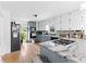 Charming kitchen featuring granite countertops, tile floors and blue and white cabinets at 195 Blackberry Run, Fayetteville, GA 30214
