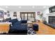 Bright living room featuring a large sectional sofa and fireplace at 195 Blackberry Run, Fayetteville, GA 30214