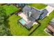 Spacious backyard features a private pool and a lovely patio area, perfect for relaxing at 314 Spring Falls Drive, Lawrenceville, GA 30045