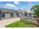 Backyard with a pool, patio, wood fence, and grassy area at 314 Spring Falls Drive, Lawrenceville, GA 30045