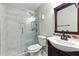 Updated bathroom with a glass shower, stylish tile, and a modern vanity at 314 Spring Falls Drive, Lawrenceville, GA 30045