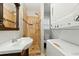 Bathroom features a beautiful, tiled shower and a stackable washer and dryer at 314 Spring Falls Drive, Lawrenceville, GA 30045