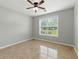 Neutral bedroom features tile floors and bright light from the window at 314 Spring Falls Drive, Lawrenceville, GA 30045
