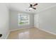 Bright bedroom features a ceiling fan and a window offering natural light at 314 Spring Falls Drive, Lawrenceville, GA 30045