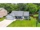 Inviting single-story home featuring an attached garage and manicured front lawn at 314 Spring Falls Drive, Lawrenceville, GA 30045