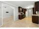 Modern kitchen with dark cabinets, granite countertops, and stainless steel appliances at 314 Spring Falls Drive, Lawrenceville, GA 30045