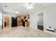 Kitchen with black appliances, light wood cabinetry, and tile flooring at 314 Spring Falls Drive, Lawrenceville, GA 30045