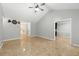 Spacious living area with tile flooring and an open layout to the kitchen at 314 Spring Falls Drive, Lawrenceville, GA 30045