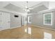 Main bedroom with tray ceiling, ceiling fan and neutral colors at 314 Spring Falls Drive, Lawrenceville, GA 30045