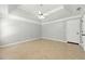 Spacious main bedroom with trey ceiling and tile floors at 314 Spring Falls Drive, Lawrenceville, GA 30045