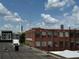 Rooftop building with brick and gray accents under a bright blue sky at 320 Martin Luther King Jr Se Dr # 9, Atlanta, GA 30312