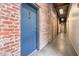 Hallway with exposed brick walls and industrial-style lighting at 320 Martin Luther King Jr Se Dr # 9, Atlanta, GA 30312