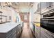 Spacious kitchen featuring a large island, modern appliances, and exposed brick wall at 320 Martin Luther King Jr Se Dr # 9, Atlanta, GA 30312