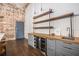 Kitchen area with wine cooler, wood countertop, and industrial shelving at 320 Martin Luther King Jr Se Dr # 9, Atlanta, GA 30312