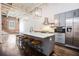 Stylish kitchen featuring an island with seating, stainless steel appliances, and wood floors at 320 Martin Luther King Jr Se Dr # 9, Atlanta, GA 30312